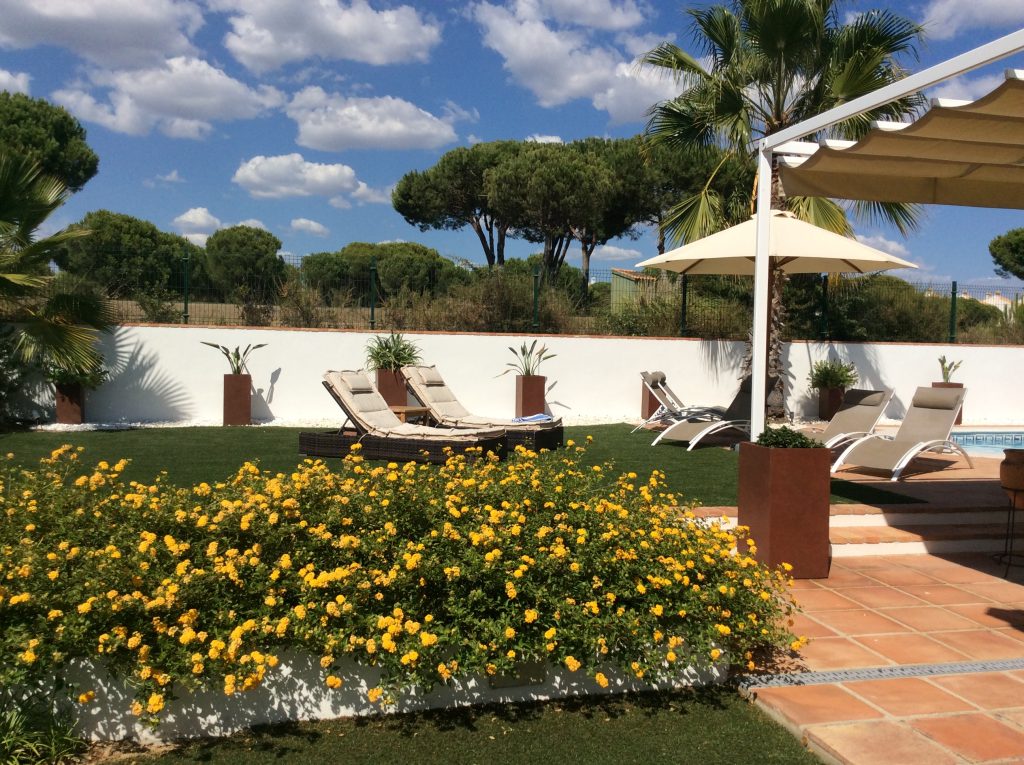 Patio garden with golf course behind